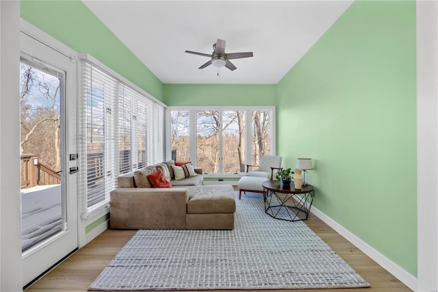 sunroom featuring ceiling fan