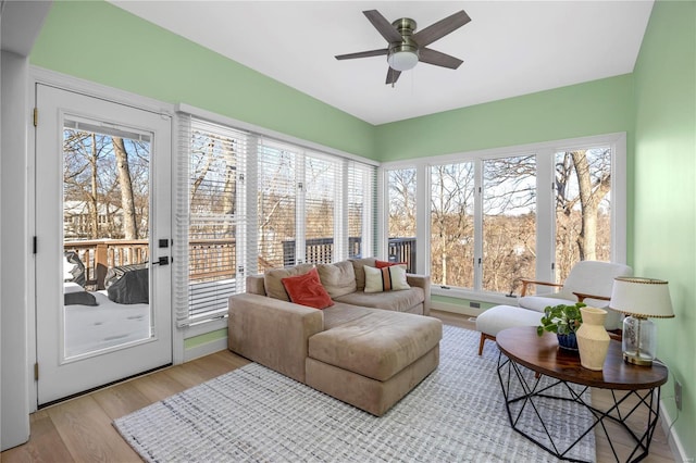 sunroom with ceiling fan and plenty of natural light