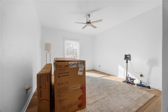 interior space featuring ceiling fan and wood-type flooring