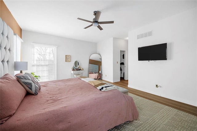 bedroom featuring ceiling fan and wood-type flooring