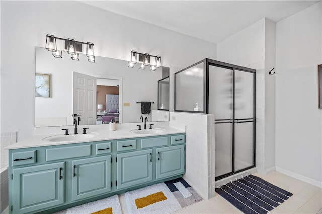 bathroom featuring an enclosed shower and vanity