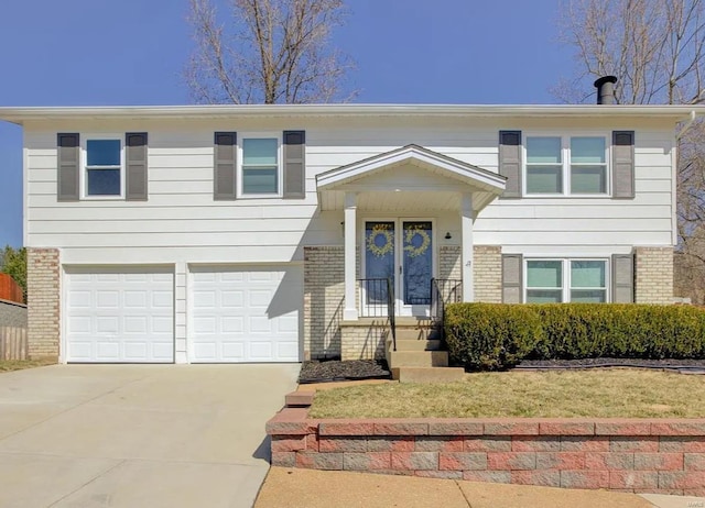 bi-level home featuring a garage