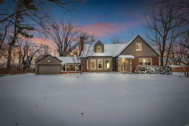 cape cod-style house with a garage