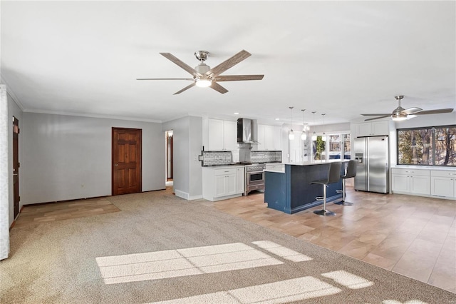 interior space featuring ceiling fan, light colored carpet, and ornamental molding