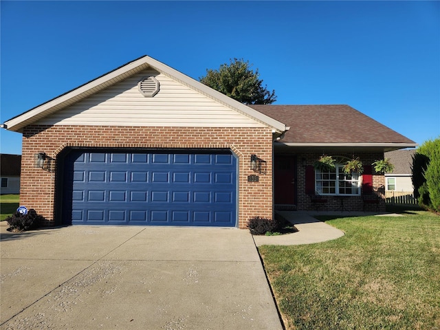 view of front facade featuring a front lawn and a garage