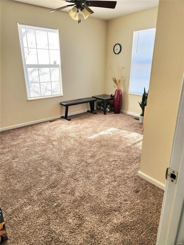 interior space featuring ceiling fan