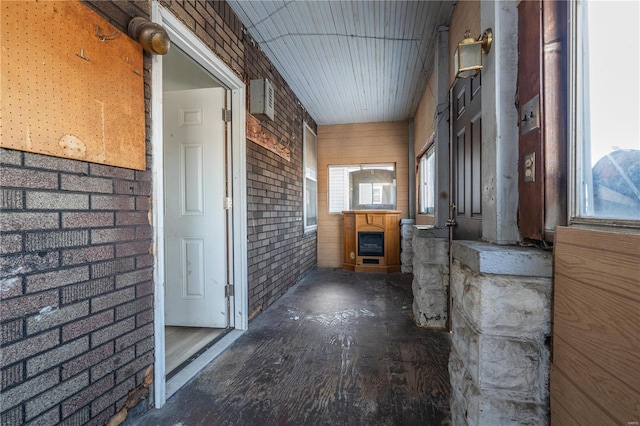 interior space featuring a wealth of natural light and brick wall