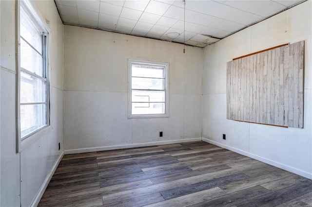 empty room featuring dark hardwood / wood-style flooring