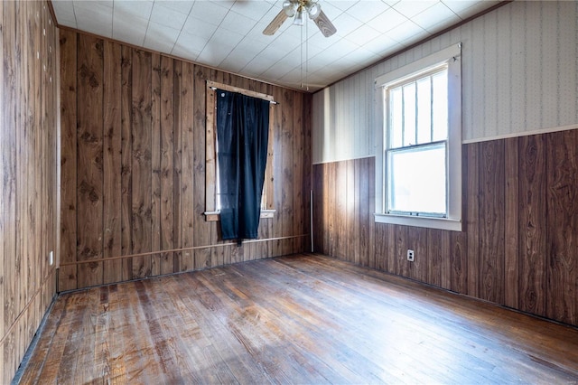 spare room featuring ceiling fan and hardwood / wood-style flooring