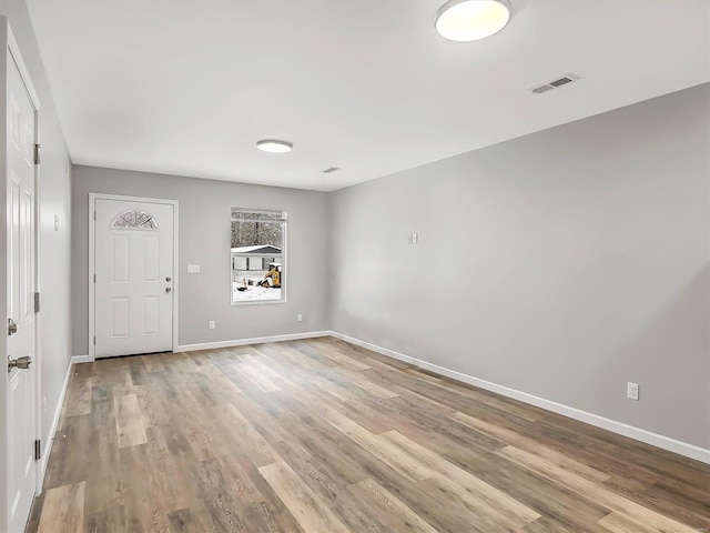 spare room with light hardwood / wood-style flooring