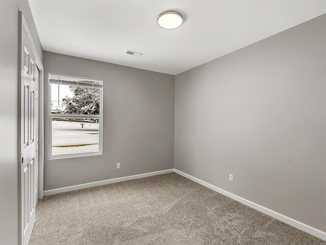 view of carpeted spare room