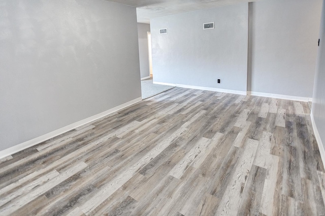 spare room featuring light wood-type flooring