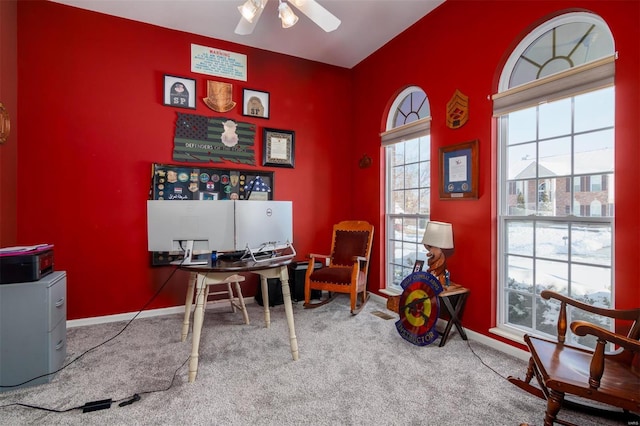 carpeted home office with ceiling fan