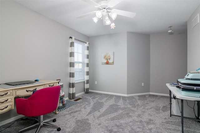 carpeted office space featuring ceiling fan