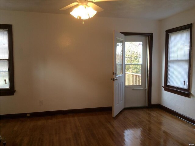 doorway to outside featuring dark hardwood / wood-style flooring and ceiling fan