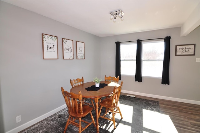 dining area featuring dark hardwood / wood-style flooring