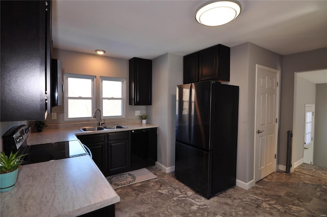 kitchen with sink, electric range, and black fridge