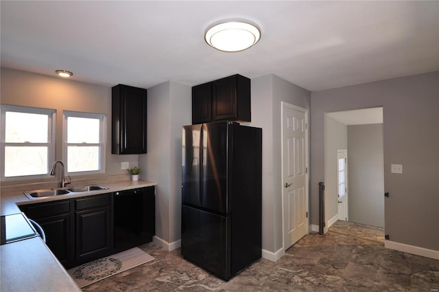 kitchen with black fridge and sink