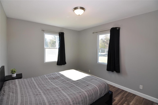 bedroom featuring dark wood-type flooring