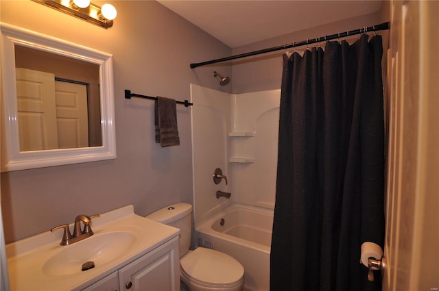 full bathroom with vanity, shower / bath combo, and toilet