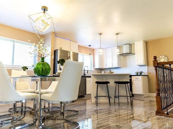 dining room featuring an inviting chandelier and sink