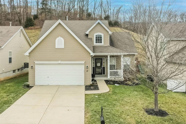 view of front of home featuring a garage, a porch, and a front lawn