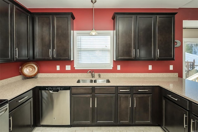 kitchen with a healthy amount of sunlight, pendant lighting, sink, and stainless steel dishwasher