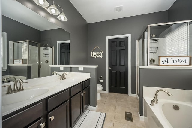 full bathroom with vanity, plus walk in shower, tile patterned floors, and toilet