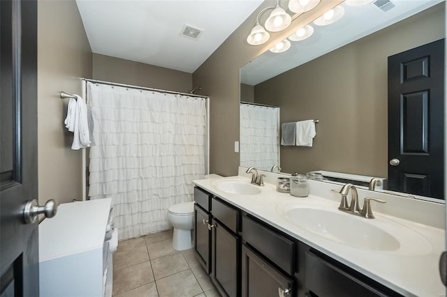 bathroom featuring tile patterned flooring, vanity, toilet, and a shower with shower curtain