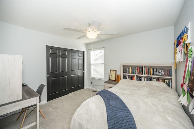 bedroom featuring a closet, ceiling fan, and carpet