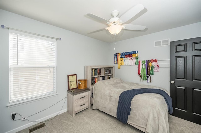 carpeted bedroom featuring ceiling fan