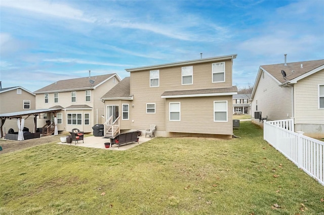 back of property featuring a patio and a lawn