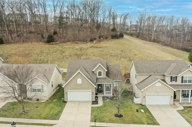 view of front of property featuring a garage and a front yard