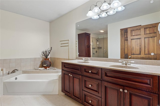 bathroom featuring tile patterned flooring, vanity, and plus walk in shower