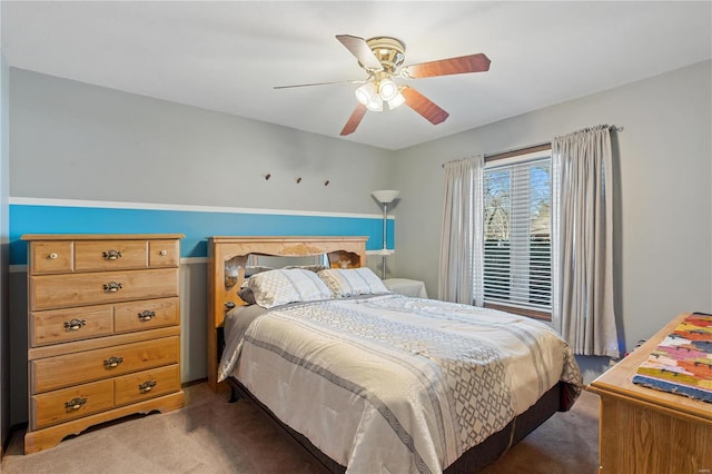 bedroom featuring dark colored carpet and ceiling fan