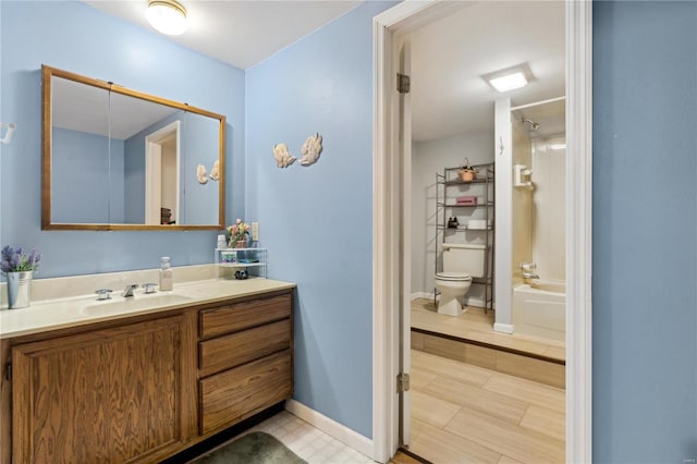 full bathroom featuring vanity, toilet, and shower / bath combination