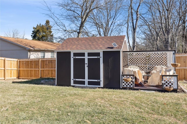 view of outdoor structure with a lawn