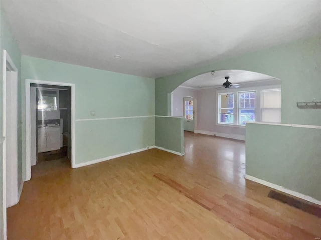 spare room featuring hardwood / wood-style flooring and ceiling fan