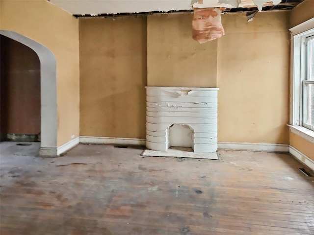 unfurnished living room featuring a wealth of natural light