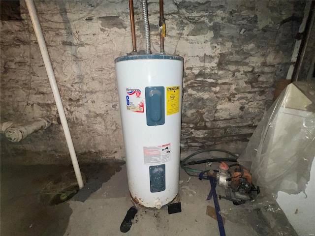 utility room featuring water heater