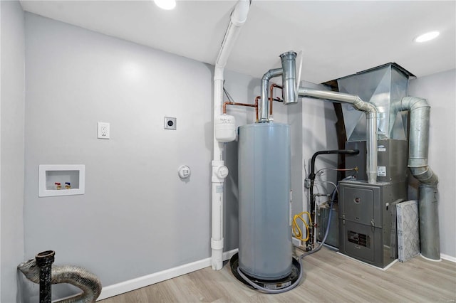 utilities featuring heating unit and gas water heater