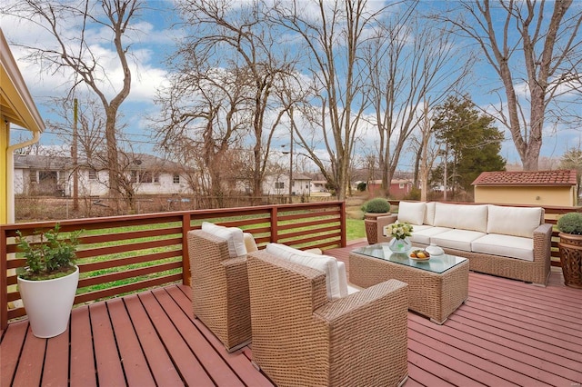 wooden terrace with an outdoor hangout area and a yard