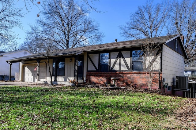 view of front of house featuring a front lawn, central AC unit, and a garage