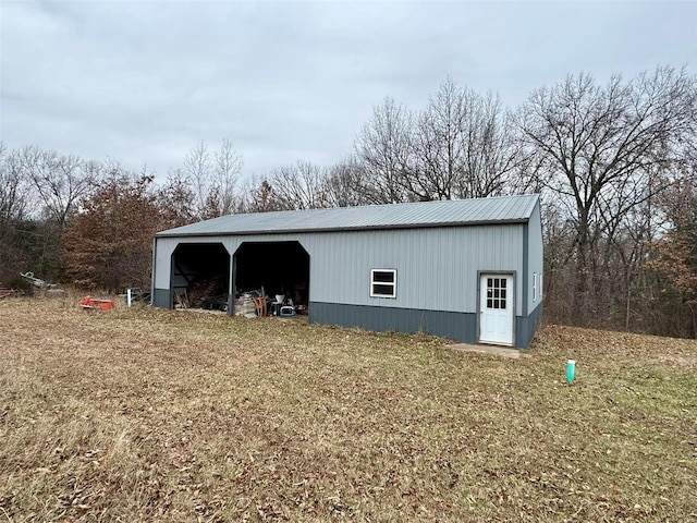 view of outbuilding with a yard