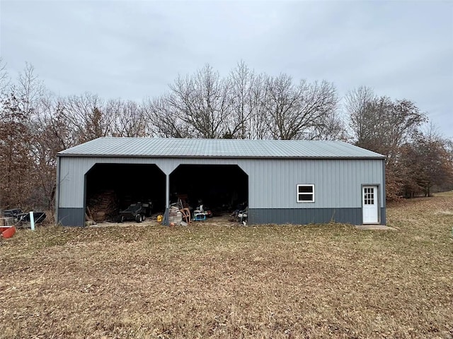 view of outdoor structure with a yard