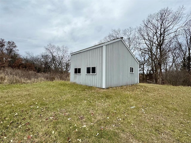 view of outbuilding with a lawn