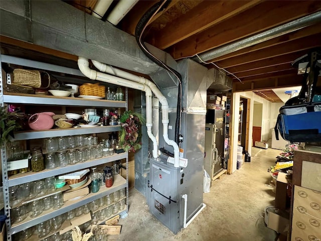 utility room featuring heating unit