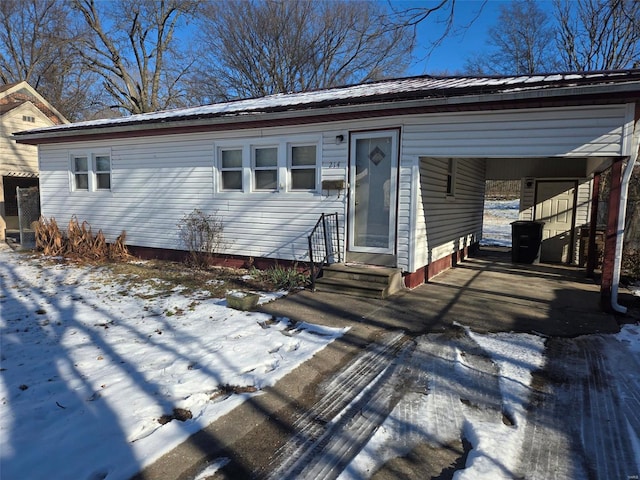 view of front of property with a carport