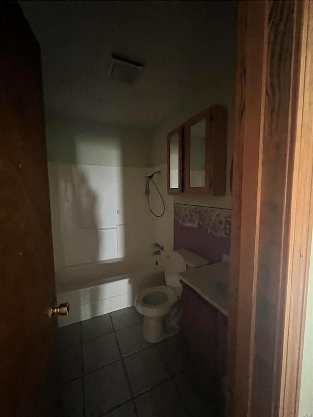 full bathroom with vanity, bathtub / shower combination, tile patterned floors, and toilet