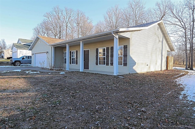 view of front of home featuring a garage and a porch